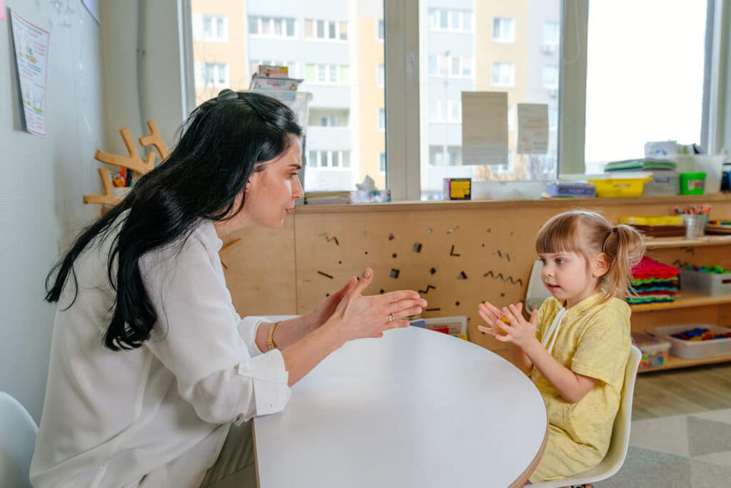 Speech Therapy - Child Therapist - Child Working with Therapist - Therapy COnnection